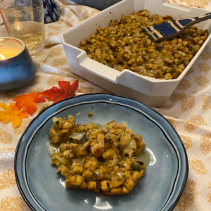 Oyster Stuffing served on blue plate on Thanksgiving table