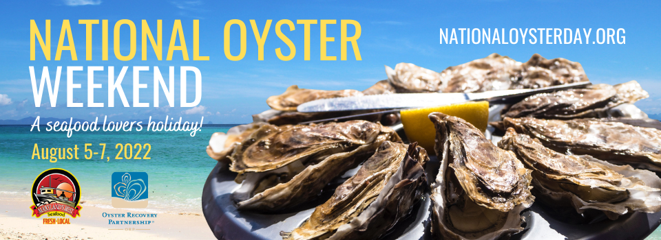 Oysters on a platter in front of ocean scene